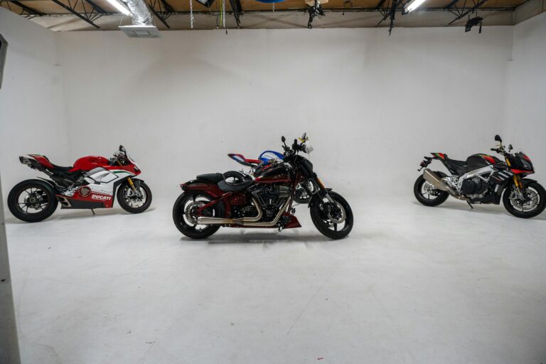 Three distinct motorcycles displayed in a white studio environment, showcasing their unique designs.
